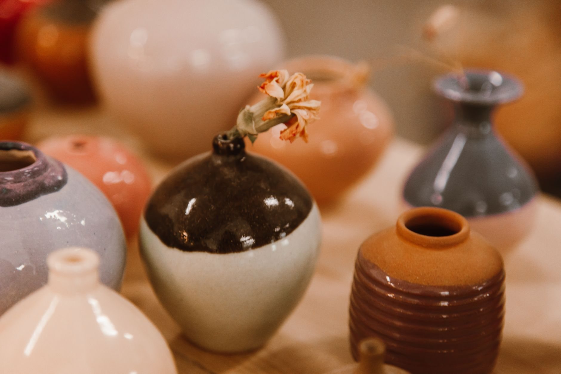 Studio workspace with ceramic pieces and photography equipment