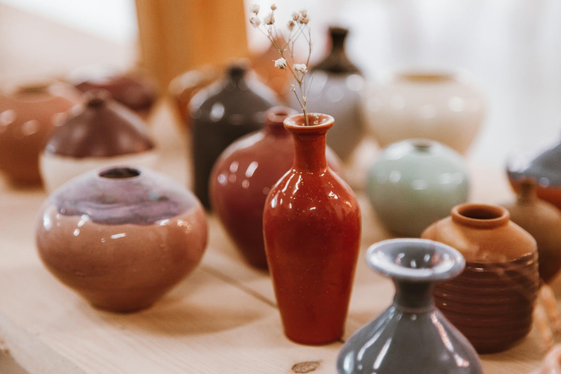 Sunlit tabletop setup with ceramic pieces and natural styling